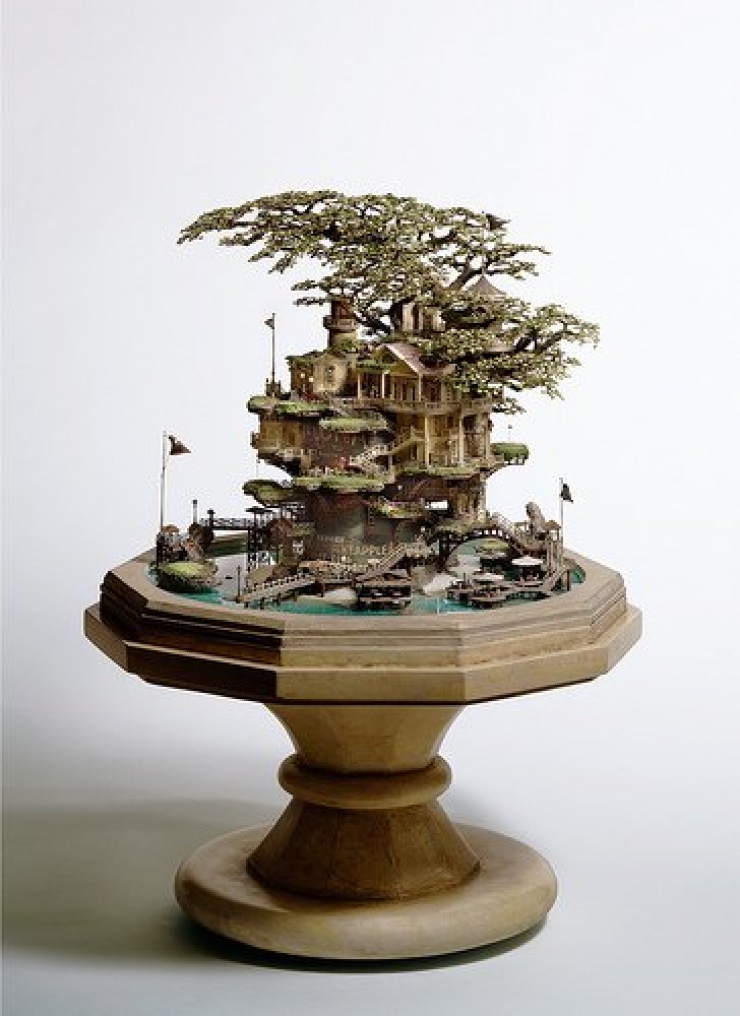 Illustration de l'article : Il transforme des bonsa&iuml;s en magnifiques maisons miniatures